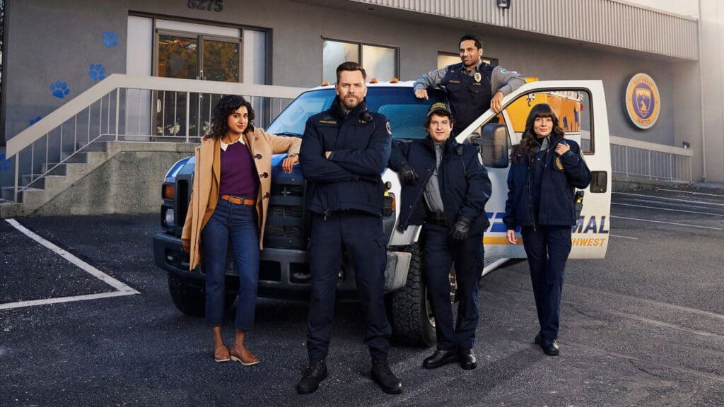 The main Animal Control cast poses outside their truck, highlighting the ensemble driven workplace dynamic at the heart of the series.