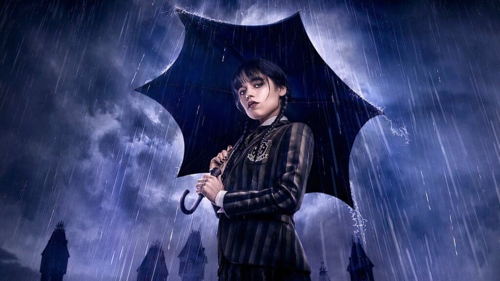 Wednesday Addams holding an umbrella in heavy rain with a gothic city backdrop