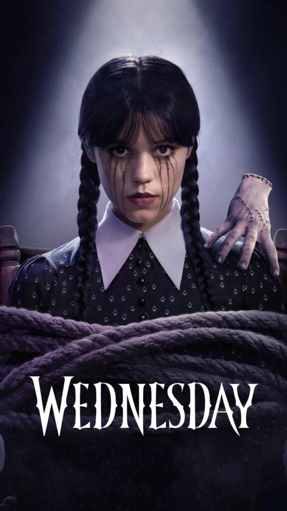 Wednesday series poster featuring a dark gothic portrait of a girl with braided hair, black tears, and a stitched hand resting on her shoulder.