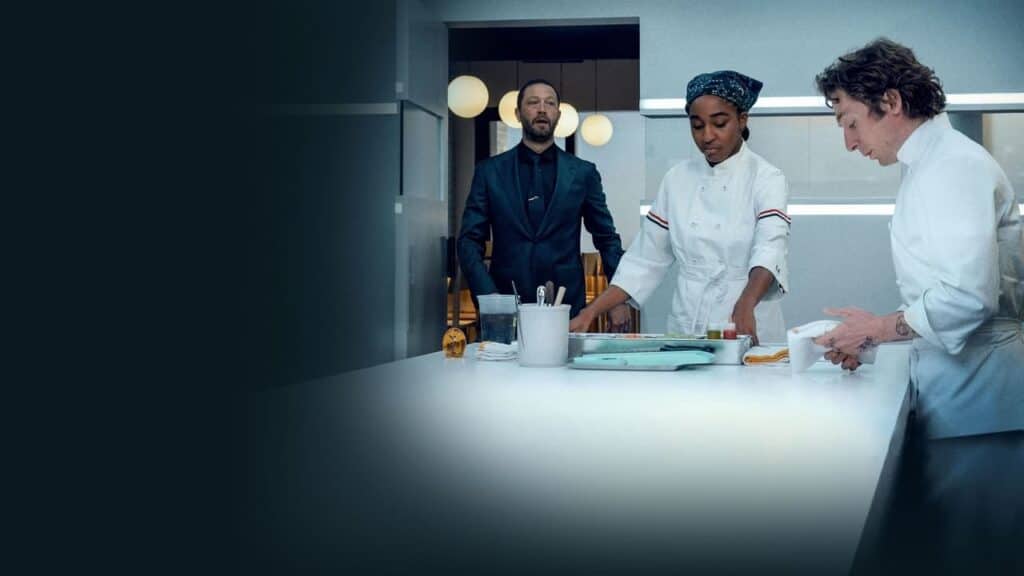 Carmy and Sydney carefully plate food in a bright modern kitchen as the restaurant evolves