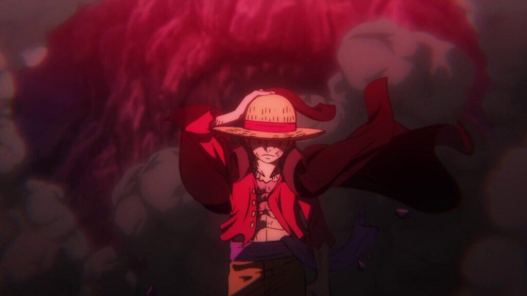 Monkey D. Luffy from One Piece stands alone with his straw hat pulled low as red smoke and debris swirl behind him, creating a tense and dramatic mood.
