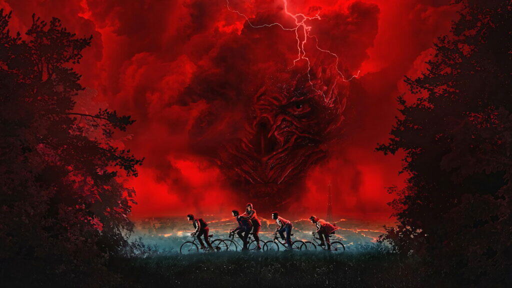 A group of kids ride bicycles at night as a massive red storm cloud forms the shape of a monstrous face above the town of Hawkins, symbolizing the looming threat of the Upside Down.