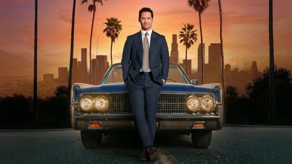 Mickey Haller standing in front of his Lincoln car in The Lincoln Lawyer Netflix legal drama