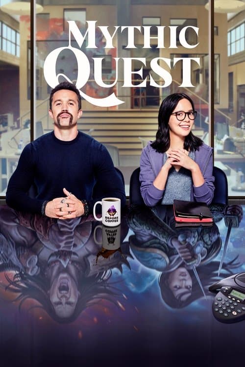Rob McElhenney as Ian Grimm and Charlotte Nicdao as Poppy Li sitting at a conference table with the Mythic Quest logo above them and reflections of their video game characters in the table surface.