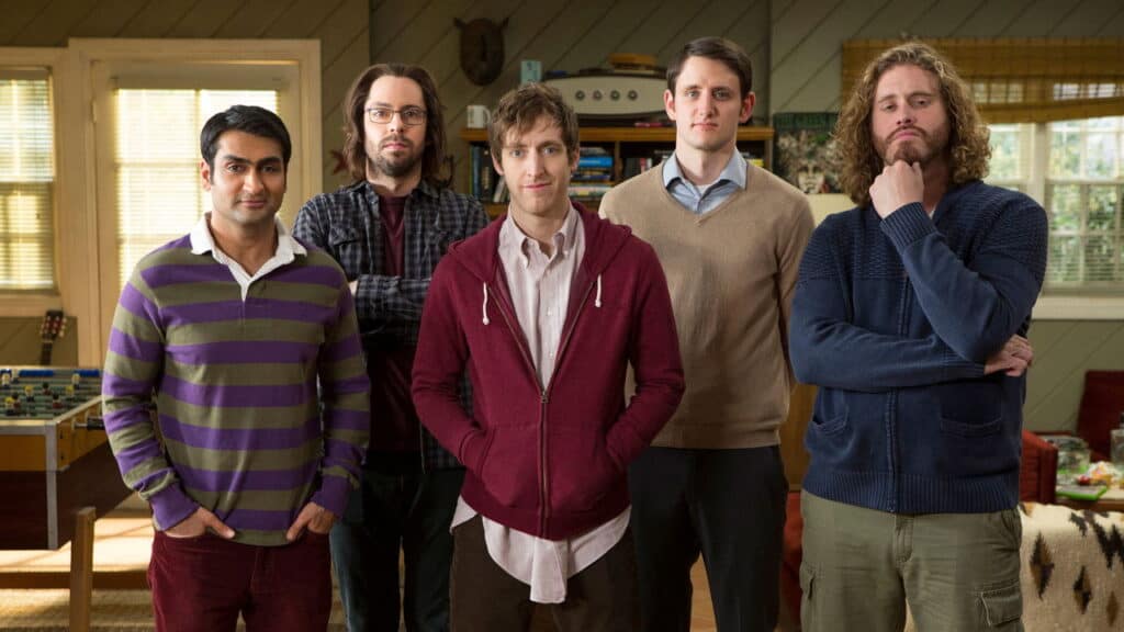 Silicon Valley promotional cast photo showing the five main characters standing together inside the house.