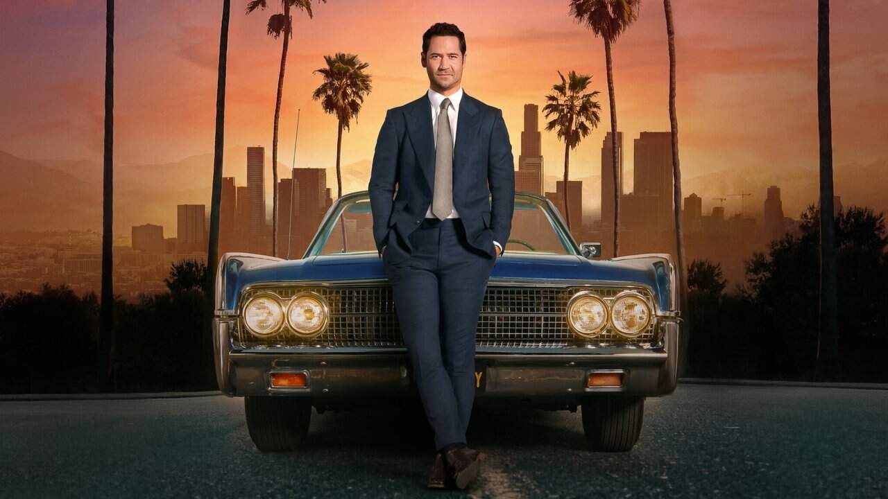 Mickey Haller standing in front of his Lincoln car in The Lincoln Lawyer Netflix legal drama